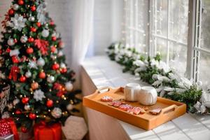 Beautiful Christmas festive interior in a country house on Christmas Eve photo