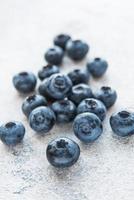 Blueberries on grey concrete background photo