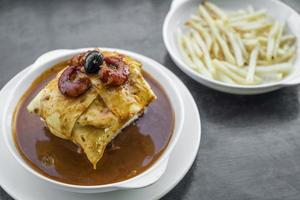 francesinha traditional meat cheese spicy sauce grilled sandwich porto portugal