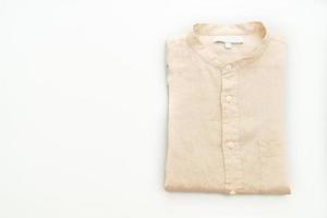 beige shirt fold on white background photo