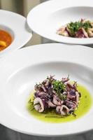 portuguese traditional fresh seafood marinated squid salad in coriander oil photo