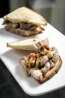 famous traditional portuguese bifana pork sandwich snack in lisbon cafe photo