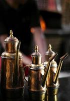 olive oil copper cruet traditional dispenser detail in italian restaurant photo