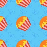 Colorful seamless pattern of appetizing cupcakes on a blue background. Simple flat vector illustration. For the design of paper wallpapers, fabric, wrapping paper, covers