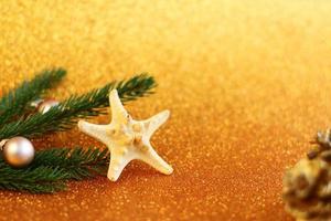 Tropical Christmas decoration, sea star and fur tree  New Year festive congratulation card with tropic details photo