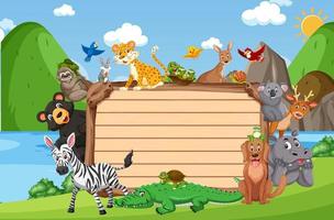 Empty wooden board with various wild animals in the forest vector