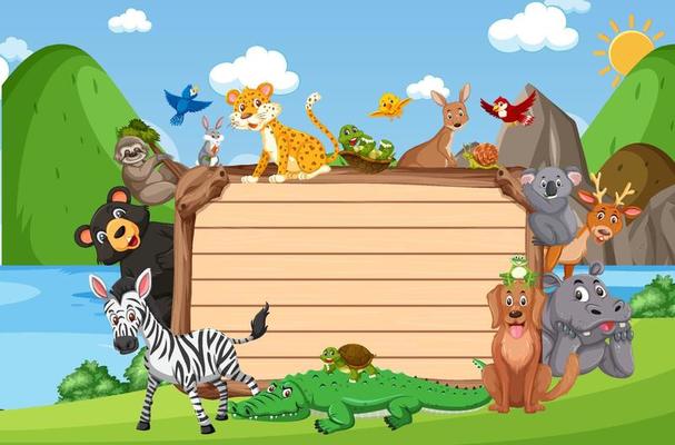 Empty wooden board with various wild animals in the forest