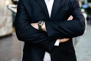 Cropping image folded male hands, one hand with watch closeup. - Image photo