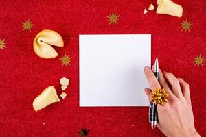 Top view of Christmas letter in Santa Claus hand. photo