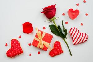 On a white background is a composition of red roses, gifts and hearts. Valentine's Day them photo