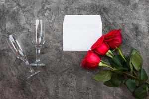 Valentines day romantic background - red roses and glasses photo