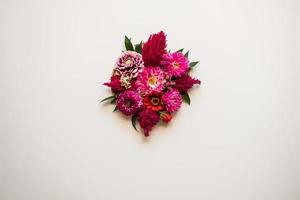 bouquet of fresh flower in the center of a white background photo