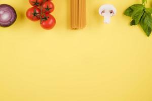 Italian food or ingredients background with fresh vegetables, pasta. Top view, view from above. Copy space. photo