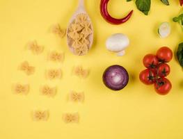 Set of farfalle pasta products, top view photo