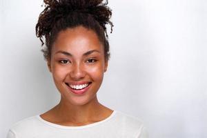 Closeup portrait of a cheerful girl over light studio background- Image photo