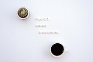 an inscription grove your business on the white desk next a cactus and a cup of coffee photo