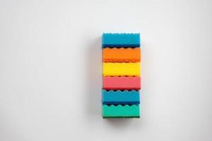 Multi-colored sponges for washing dishes  on a white background. - Image photo