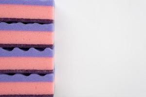 Multi-colored sponges for washing dishes isolated on a white background. Copy space photo