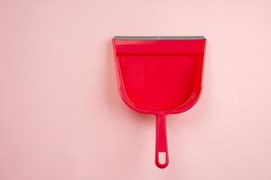 Top view of red plastic dustpan isolated on white background photo