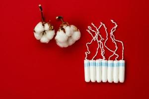Women's health care, cotton tampon, intimate hygiene, gynecological menstruation cycle. photo