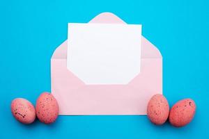 Empty template mockup white blank in the pink  envelope Easter background.  - Copyspace photo