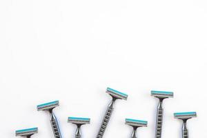 Disposable shaving razor on white background, copy space photo