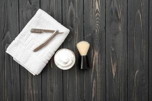 Image of shaving tools, brush, foam, shaver. photo