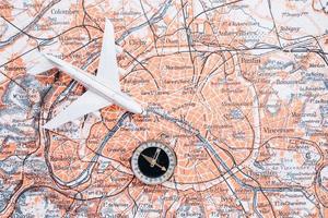 Compass on the background of the map. Magnetic compass and topographic map. photo