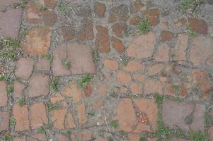 Texture of old masonry on the road photo