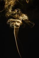 Smoke floating on dark background photo