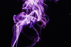 Smoke floating on dark background photo