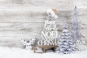 Christmas tree on wooden background.