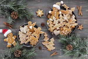 Homemade christmas gingerbread cookies on wooden table. photo