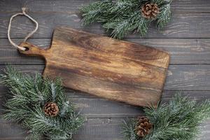 Empty cutting board on a old christmas rustik table. photo