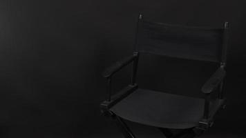 Director chair isolated.It is use in video production or movie and cinema industry. It's put on BLACK background. photo