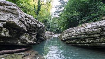 Beautiful forest and mountain river in Psakho canyon, Krasnodar Krai, Russia. photo