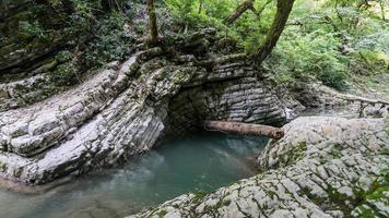 Beautiful forest and mountain river in Psakho canyon, Krasnodar Krai, Russia. photo