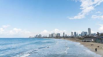 Seascape and skyscrapers on background in Tel Aviv, Israel. photo