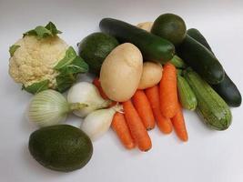 Variety of fresh vegetables of natural origin to prepare vegetarian food photo