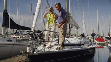 Senior couple on sailboat together. Shot on RED EPIC for high quality 4K, UHD, Ultra HD resolution.
