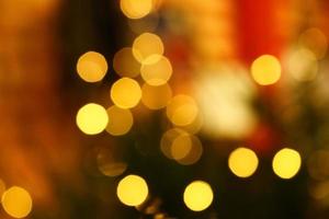 Long exposure blurred yellow christmas tree lights abstract background photo