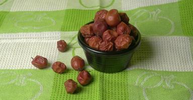 Indian jujube or ber or berry grown in the wild or jungle. Closeup of India fruit on beautiful background. photo