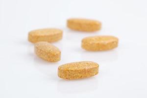 Several orange pills photo