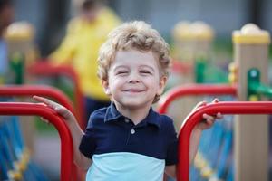 Little curly boy smiling fun photo