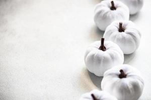 White handmade textile pumpkins as a Thanksgiving card photo