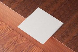 White square shape paper business card mockup on wooden brown table background. Branding presentation template print graphic design. One cards mock up. 3D illustration rendering photo