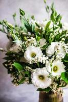 Beautiful white eustoma flowers in bouquet photo