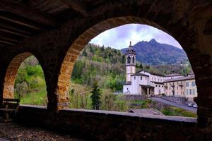 Scenic view of ancient church from a stunning old arcaded street photo