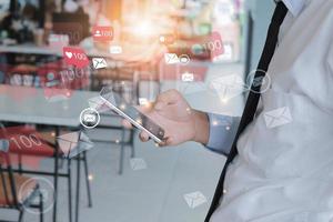 Man with mobile smart phone on social media network connection. photo