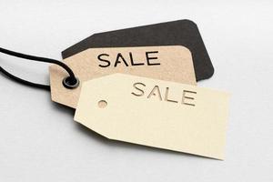Group of price tags with sale text isolated on gray background photo